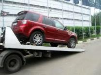 Фото процесса перевозки нового авто на эвакуаторе