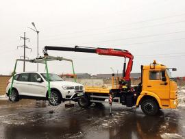 Фото погрузки авто с помощью эвакуатора с манипуялятором